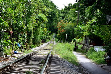 Fototapeta premium Trains running on the train tracks to the station in Thailand. Select focus with shallow depth of field.