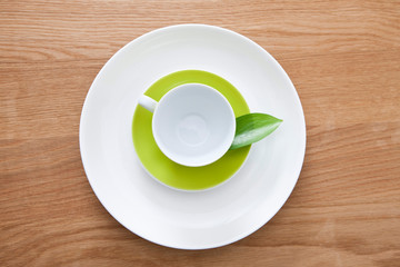 teacup and plates with leaf