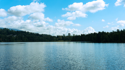Burrard Inlet looking towards Port Moody, BC, with high rises at front centre and ocean-view single family homes at right