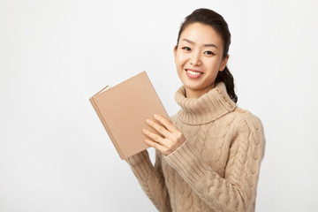young woman holding a book