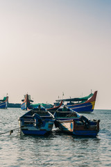 Fototapeta premium Beautiful view of boats tied in Calicut fish harbor in the evening.