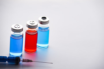 Medical ampoules for injection and syringe. medicines and disease treatment. pharmacology and science. Copy space.