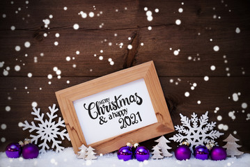 Fototapeta na wymiar Frame, Purple Ball, Tree, Snow, Snowflakes, Merry Christmas And A Happy 2021