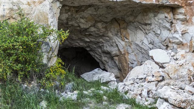 The entrance to a deep, scary dark cave.