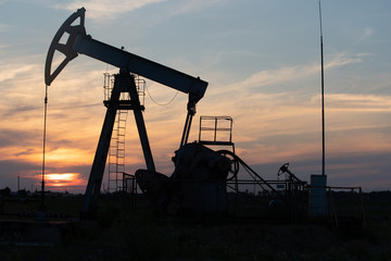 Oil Pump on orange sunset