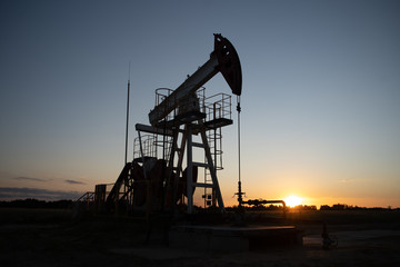 Oil Pump on orange sunset