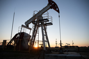 Oil Pump on orange sunset