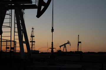 Oil Pump on orange sunset