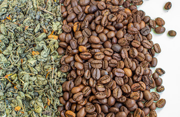 Dry green tea leaves and roasted coffee beans. Close-up view from above. The concept of coffee or green tea.