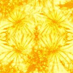 Quality genuine spider tie dye repeat pattern in bright summer yellow and orange. Seamless repeating pattern. 