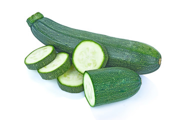 fresh green zucchini with slice isolated on white background