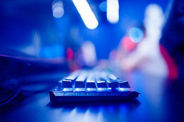 Professional cyber video gamer studio room with personal computer armchair, keyboard for stream in...