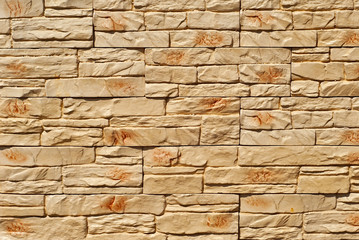 Fototapeta premium Texture of brick wall and concrete blocks. Samples of stone plates stacked evenly in a row.