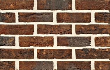 exture of brick wall. new brickwork. Samples of wall or fence are presented at exhibitions. Brown brick close up.