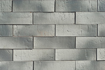 Texture of brick wall. new brickwork. Samples of wall or fence are presented at exhibitions. Gray brick close up.