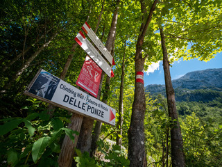 Signpost of climbing wall on mountain on the border between Italy and Slovenia called Ponza Grande. Tarvisio, Friuli Venezia Giulia