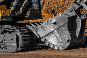 Loading excavator iron bucket mine brown coal open pit industry © Parilov