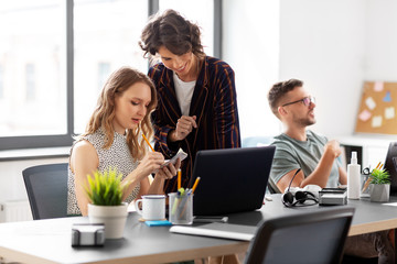 Fototapeta premium business, people and corporate concept - team of startuppers working at office