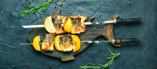 Barbecue mackerel fish on skewers