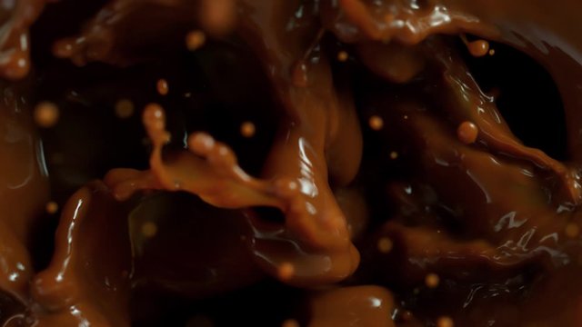 Super Slow Motion Shot of Ice Cubes Falling into Coffee at 1000 fps.