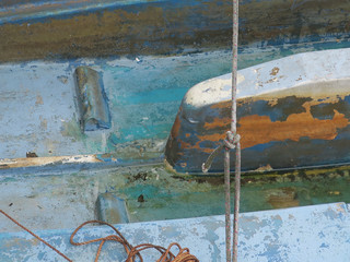 close-up of a blue polyester boat with ropes