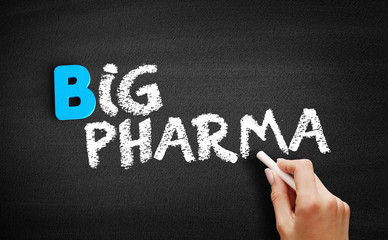 Big pharma text on blackboard, medical concept background