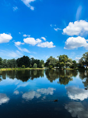 Naklejka na ściany i meble Sky reflection on the lake water, lake background