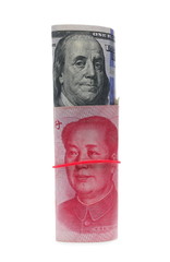 Chinese hundred yuan, renminbi bill and United States hundred-dollar banknote, rolled up cash bundles, money rolls isolated on white background