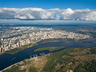 Fototapeta premium High view of the Dnieper river in Kiev. A cloud over the city.