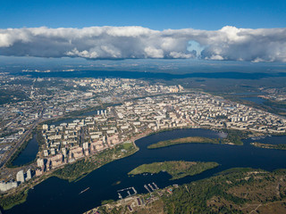 Fototapeta premium High view of the Dnieper river in Kiev. A cloud over the city.