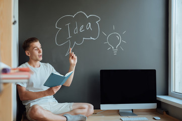 Young smiling man has an idea.Idea concept