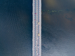 Aerial drone view. Cars travel across the Paton Bridge in Kiev.