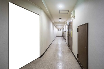A large blank billboard in the corridors of an office building