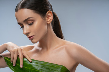 Woman with a peace lily looking down