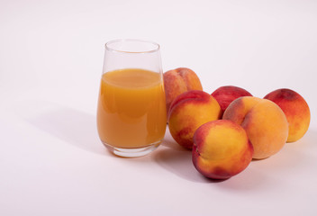 a glass of peach juice