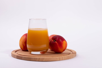 a glass of peach juice