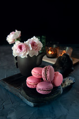 Fresh pink macaroni macarooni cookies on a wooden Board. Sweet homemade cakes. copy space