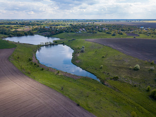 Fototapeta na wymiar Aerial drone view. Country lake in Ukraine.