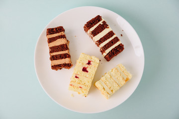 pieces of cake on white tarelke on a light background