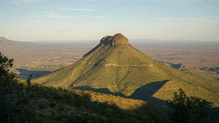 Fototapeta premium Valley of Desolation Rock Formations and hills during sunset near Graaff Reinet in South Africa.