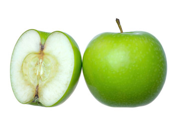 a whole fresh green apple with another half in white background