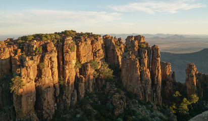 Valley of Desolation Rock Formations and hills during sunset near Graaff Reinet in South Africa.