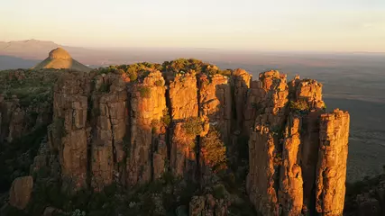 Fotobehang Chocoladebruin Valley of Desolation Rock Formations and hills during sunset near Graaff Reinet in South Africa.  © Christopher