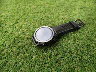 Black smart watch on the grass
