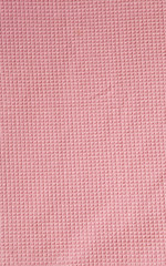Pink tablecloth fabric texture background. Top view