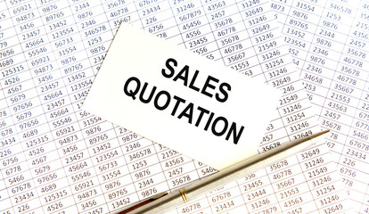 Obraz premium On the business card the inscription SALES OF THE BEST, next to the accounting, the pen.