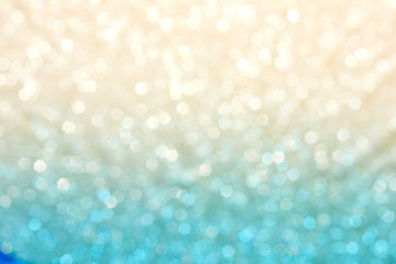 Obraz na płótnie Canvas Current collection of brilliant backgrounds for your design. Close-up shot of blurred golden and blue sparkles in portrait format.