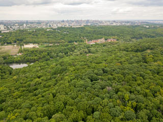 Fototapeta premium Aerial drone view. Buildings in the forest in Kiev.