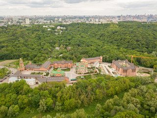 Fototapeta na wymiar Aerial drone view. Holy Intercession Holosiivsky Monastery. Monastery among the woods in Kiev.