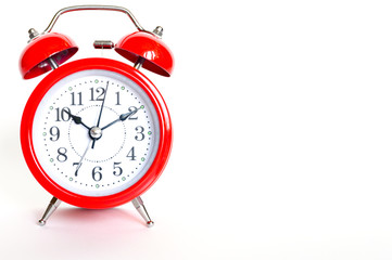 red round analog alarm clock isolated on white background. time 10:10